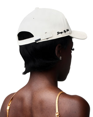 Cream-colored baseball cap crafted from comfortable cotton, with a logo detail.
