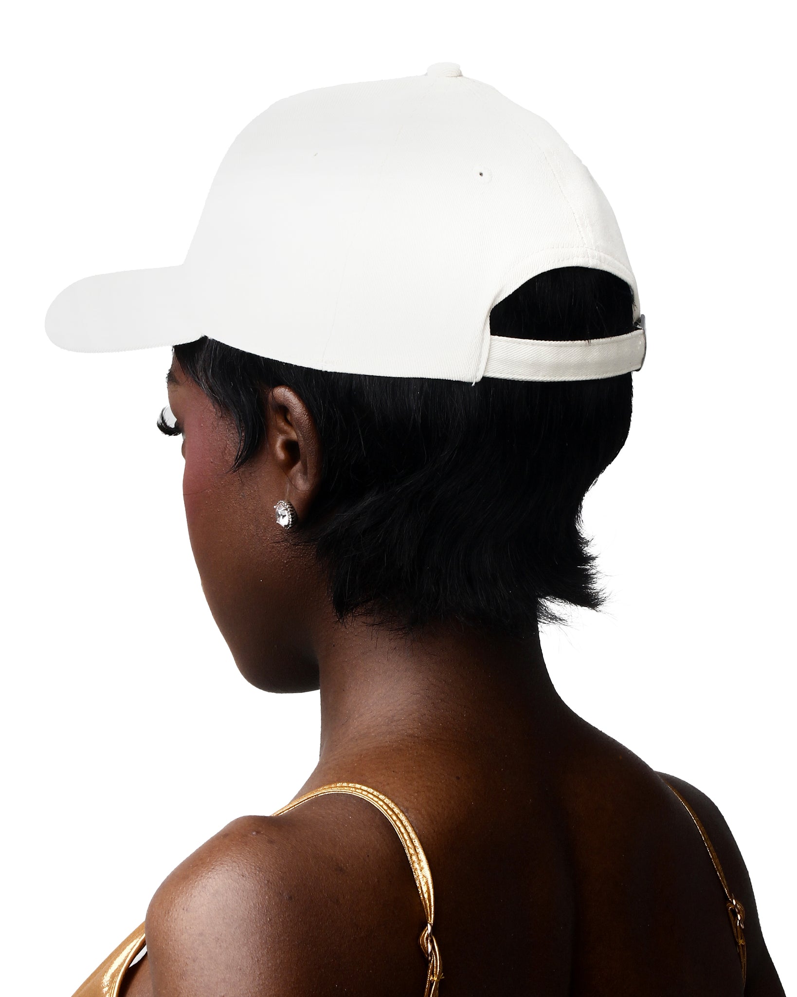Cream cotton cap with a front logo, offering both style and functionality.