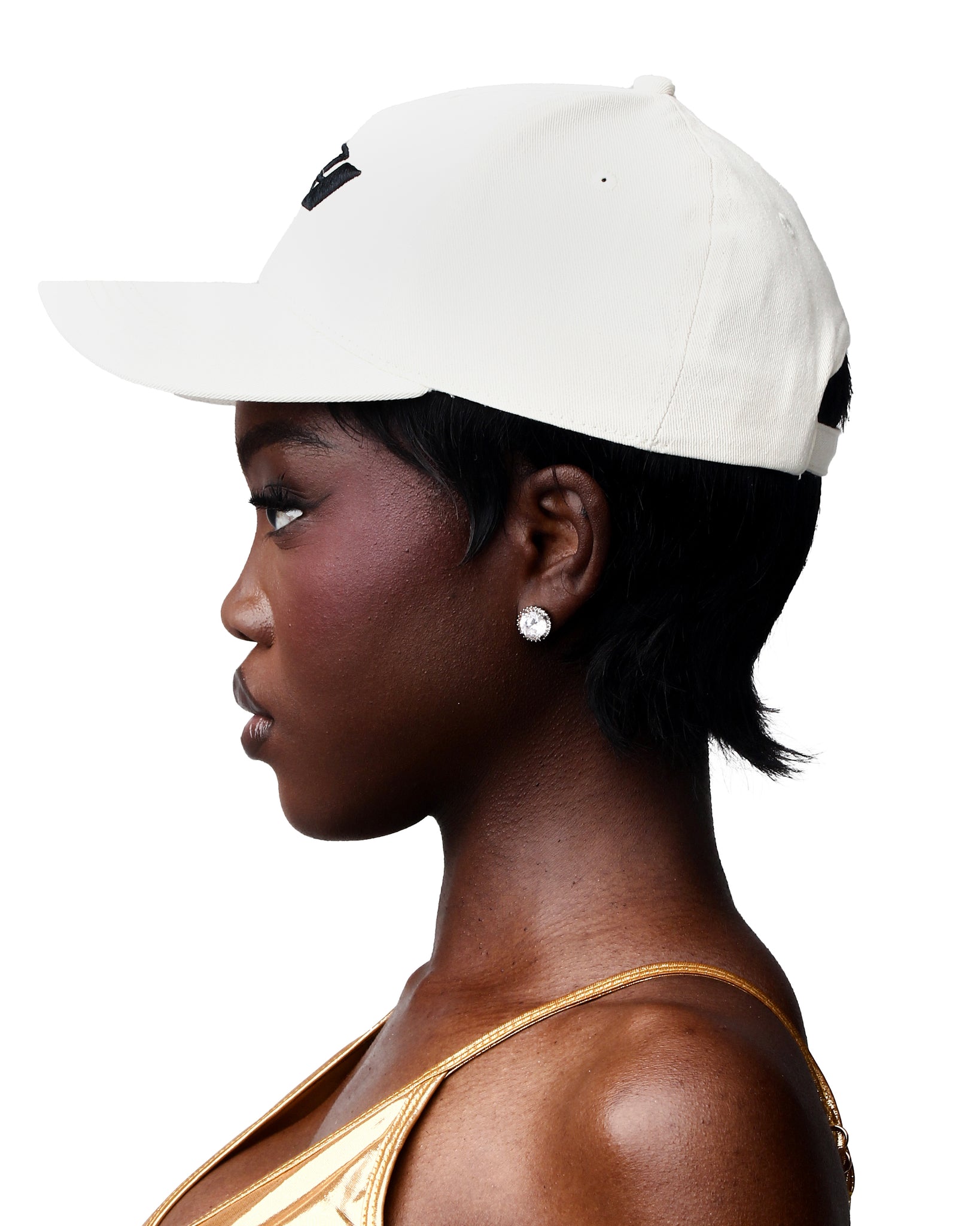 Embroidered cream baseball cap featuring a standout logo on the front.
