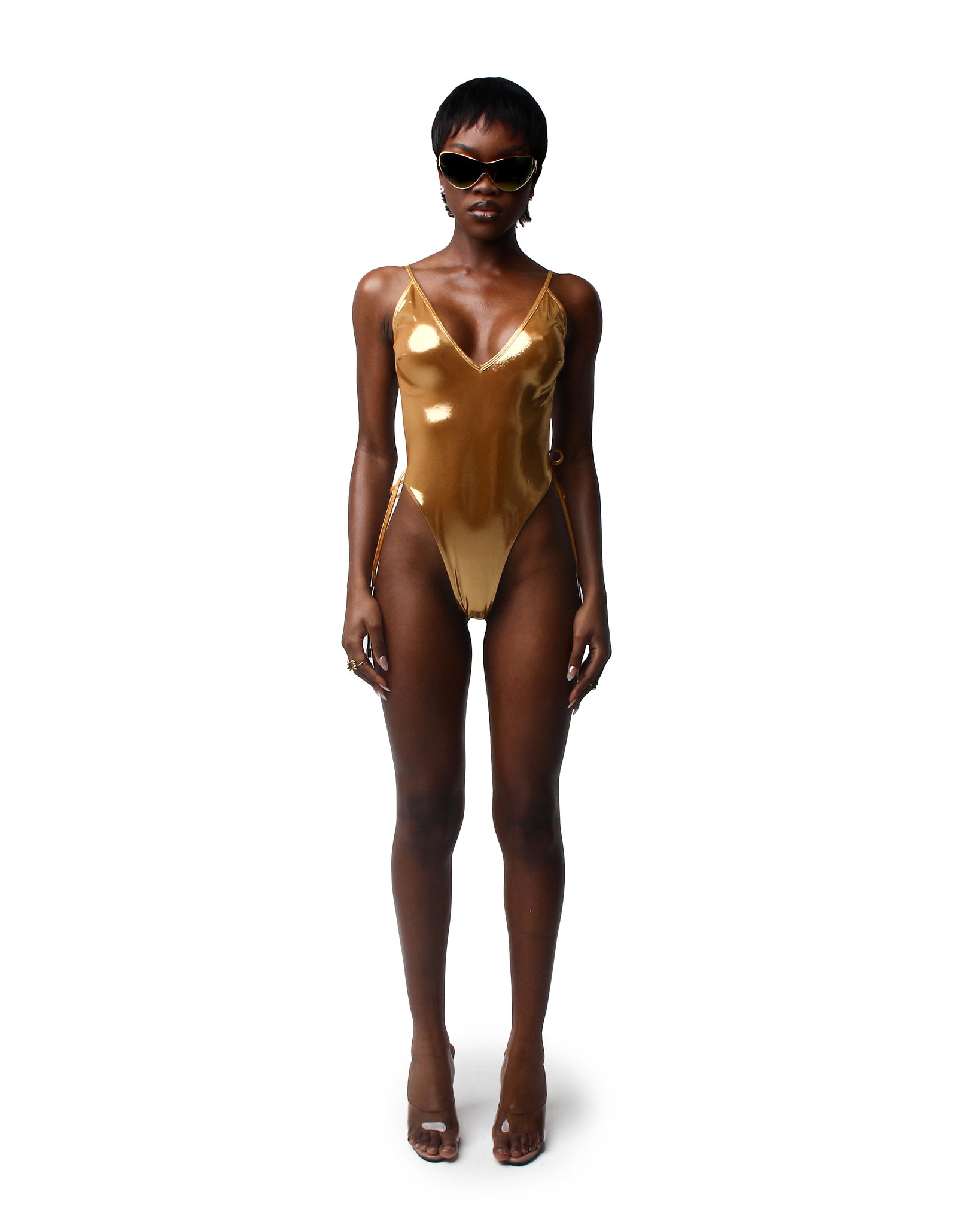 Dive into summer with our selection of women's swimwear, featuring everything from classic bikinis to trendy matching sets. This classic gold one pice looks great on everyone.